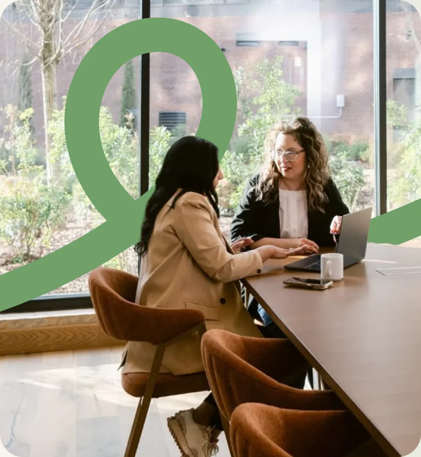 Two colleagues working together at a table